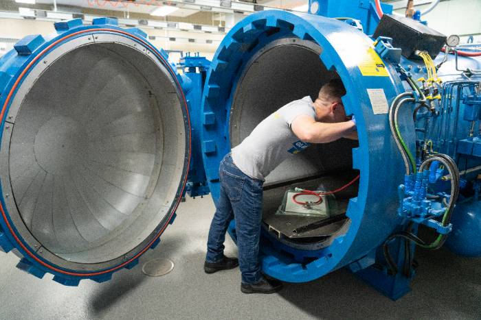 Student looking in canister