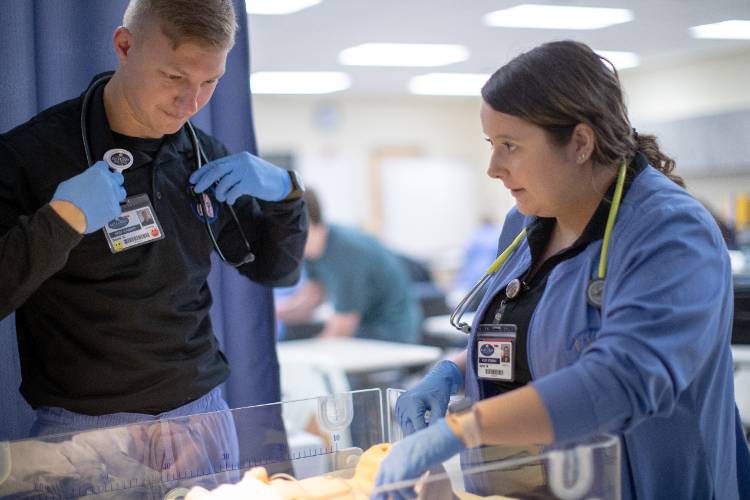 Students with oxygen for baby