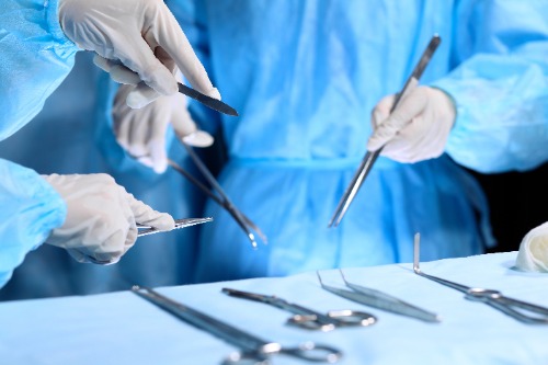 Hands with surgical instruments