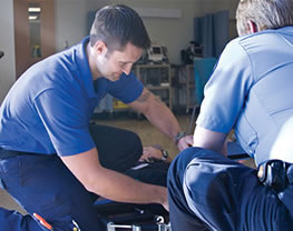 Two men giving CPR